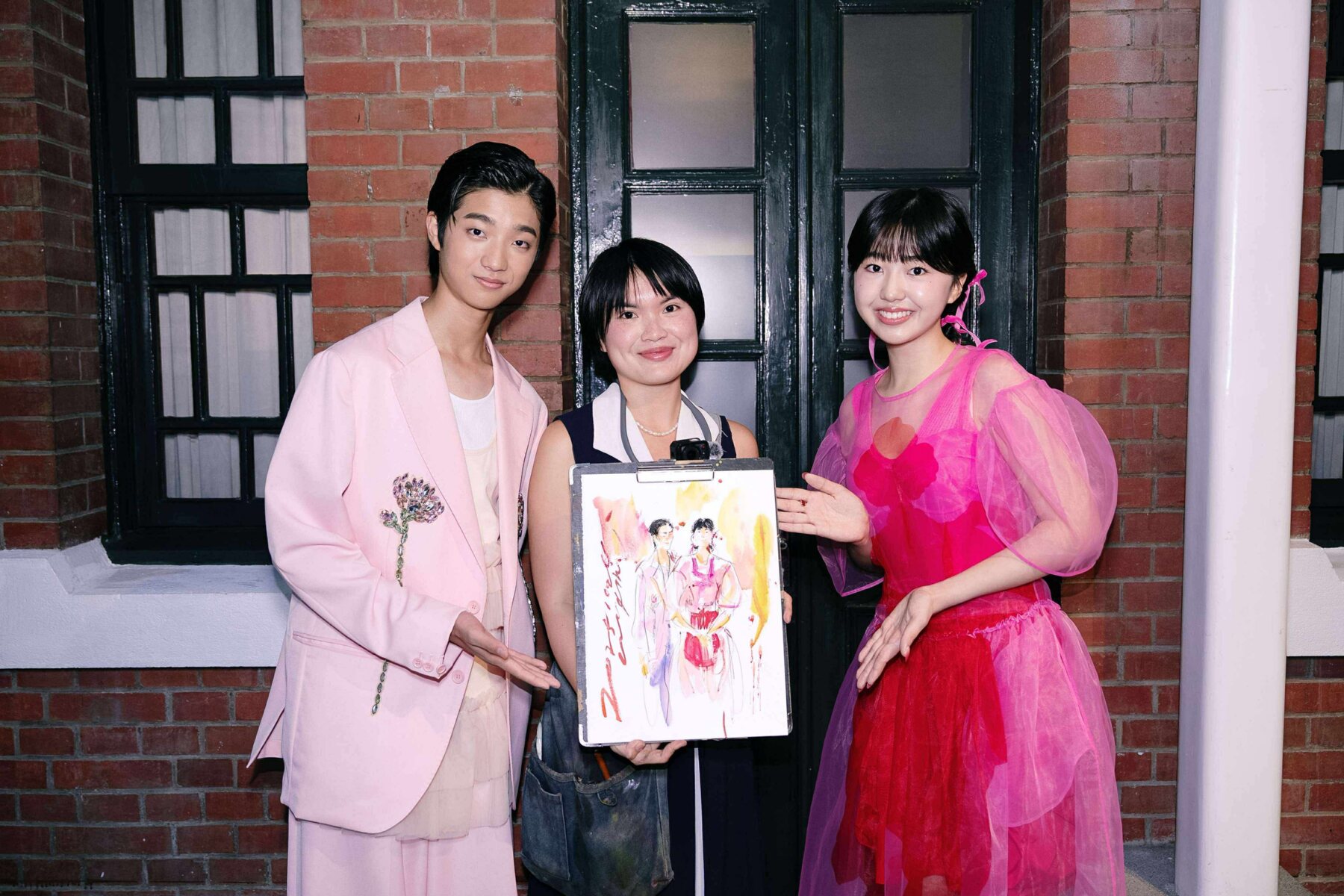 Artist and guests with a finished work