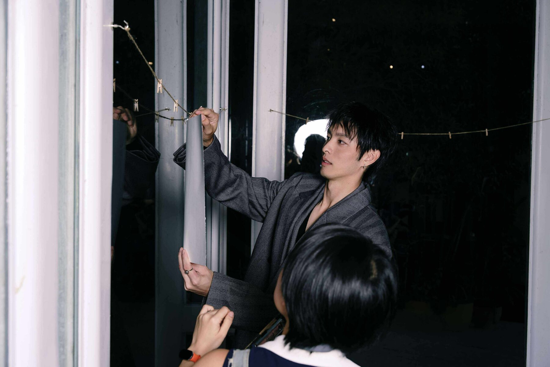Fashion talent framed by live artworks